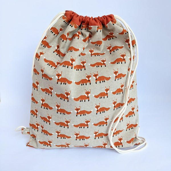 Closed Fox Drawstring Bag with Burnt umber lining and ivory drawcords
