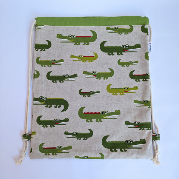 Crocodile drawstring bag with green lining and natural drawcords