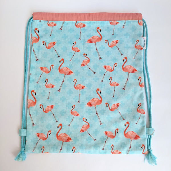 Pink Flamingos on turquoise background with coral lining and turquoise drawcords