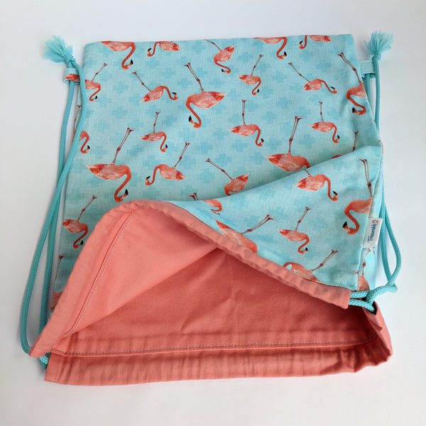 Open Pink Flamingoes on turquoise background with coral lining and turquoise drawcords