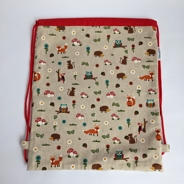 Woodland creatures drawstring bag with red lining and drawcords