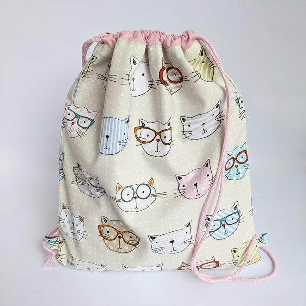Closed Cool cats drawstring bag with baby pink lining and drawcords