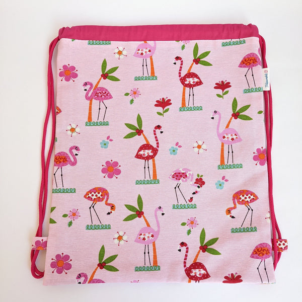 Flamingo and palm tree drawstring bag with dark pink lining and drawcords