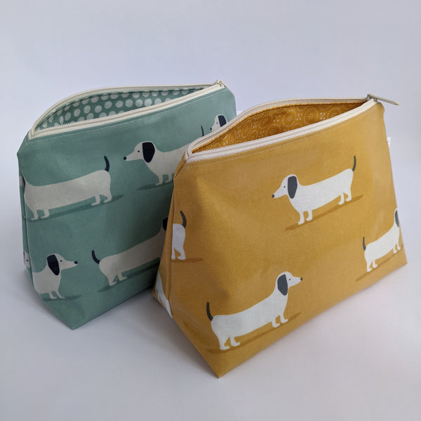 Unzipped, Medium Dachshund Oilcloth Cosmetic Bags in Duck Egg and Mustard Colours