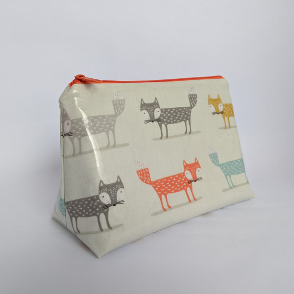 Side View of Medium Orange Oilcloth Bag, Cosmetic Bag, Wash Bag and Toiletry Bag