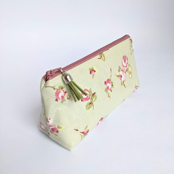Side view of mini oilcloth pouch in Sage floral design