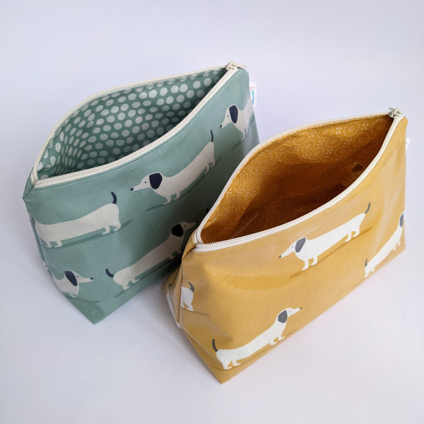Unzipped, Medium Dachshund Oilcloth Cosmetics Bags in Duck Egg and Mustard Colours