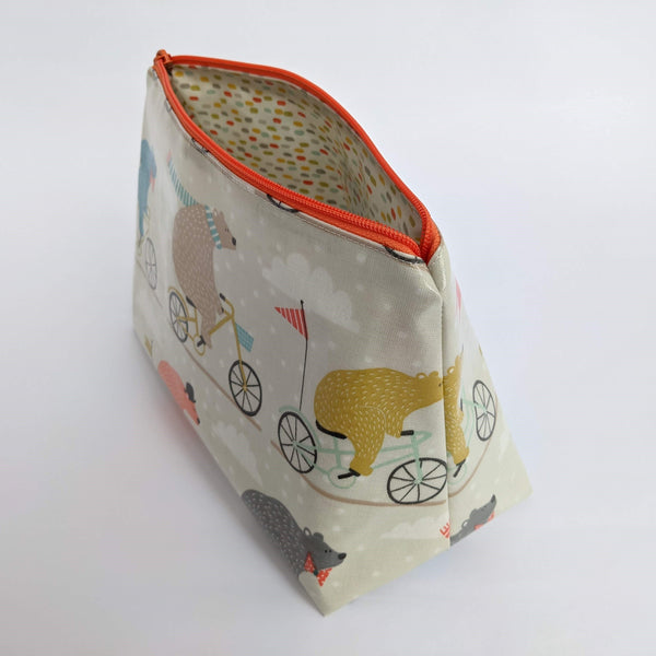 Side view of Unzipped, Medium Bears on Bicycles Oilcloth Wash Bag/ Toiletry Bag/ Cosmetics Bag with Colour coordinating Dash Lining