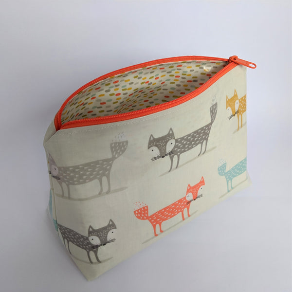Unzipped, Medium Orange Oilcloth Bag, Cosmetic Bag, Wash Bag and Toiletry Bag with Colour Coordinating Dash Oilcloth Lining