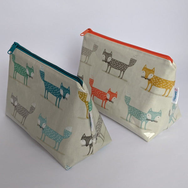 Side View of Medium Orange & Teal Oilcloth Bag, Cosmetic Bag, Wash Bag and Toiletry Bag