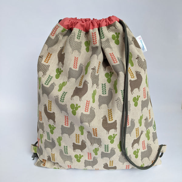 Closed Llamas Drawstring backpack with coral pink lining and dark grey drawcords