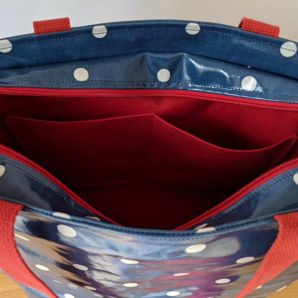 Unzipped, Demin Blue, Large Oilcloth Shoulder bag with recessed red zip, Cotton Webbing handles and red lining with internal pockets
