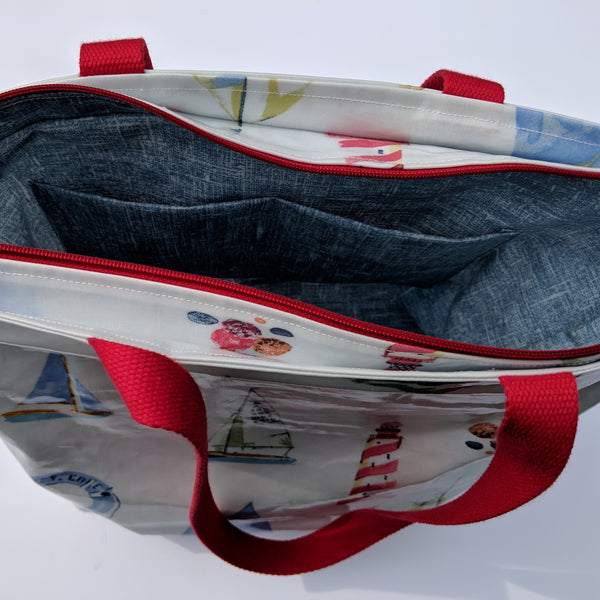 Internal View of Nautical Style Large Oilcloth Shoulder Bag with Red Cotton Webbing Handles and Recessed Zip.
