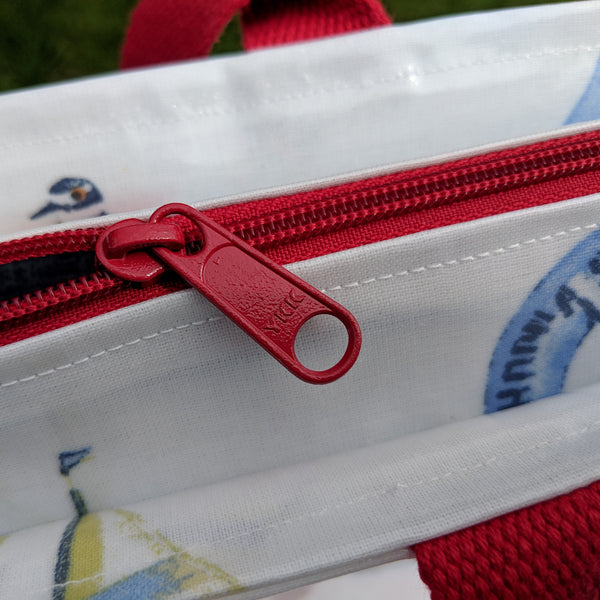 Close up of YKK Zip on Nautical Style Large Oilcloth Shoulder Bag with Red Cotton Webbing Handles.